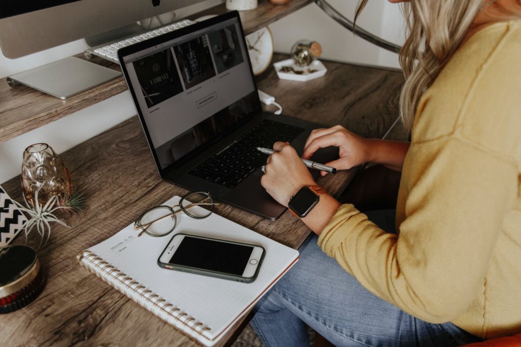 Woman sitting at desk with to-do list